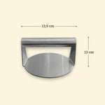 Stainless steel smash burger press, 13.9 cm wide and 13 cm high, with a sturdy tubular handle.