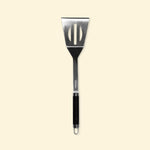 Long XL stainless steel spatula with black handle, front view on a plain background, ideal for flipping and handling food on the griddle.