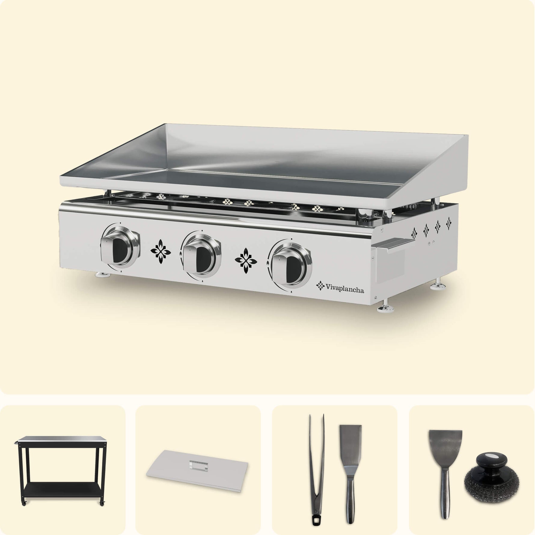 Vivaplancha set including a stainless steel griddle with three burners, a black trolley, a stainless steel lid, tongs, a serving spatula, a cleaning spatula, and a cleaning pad, displayed on a plain background.