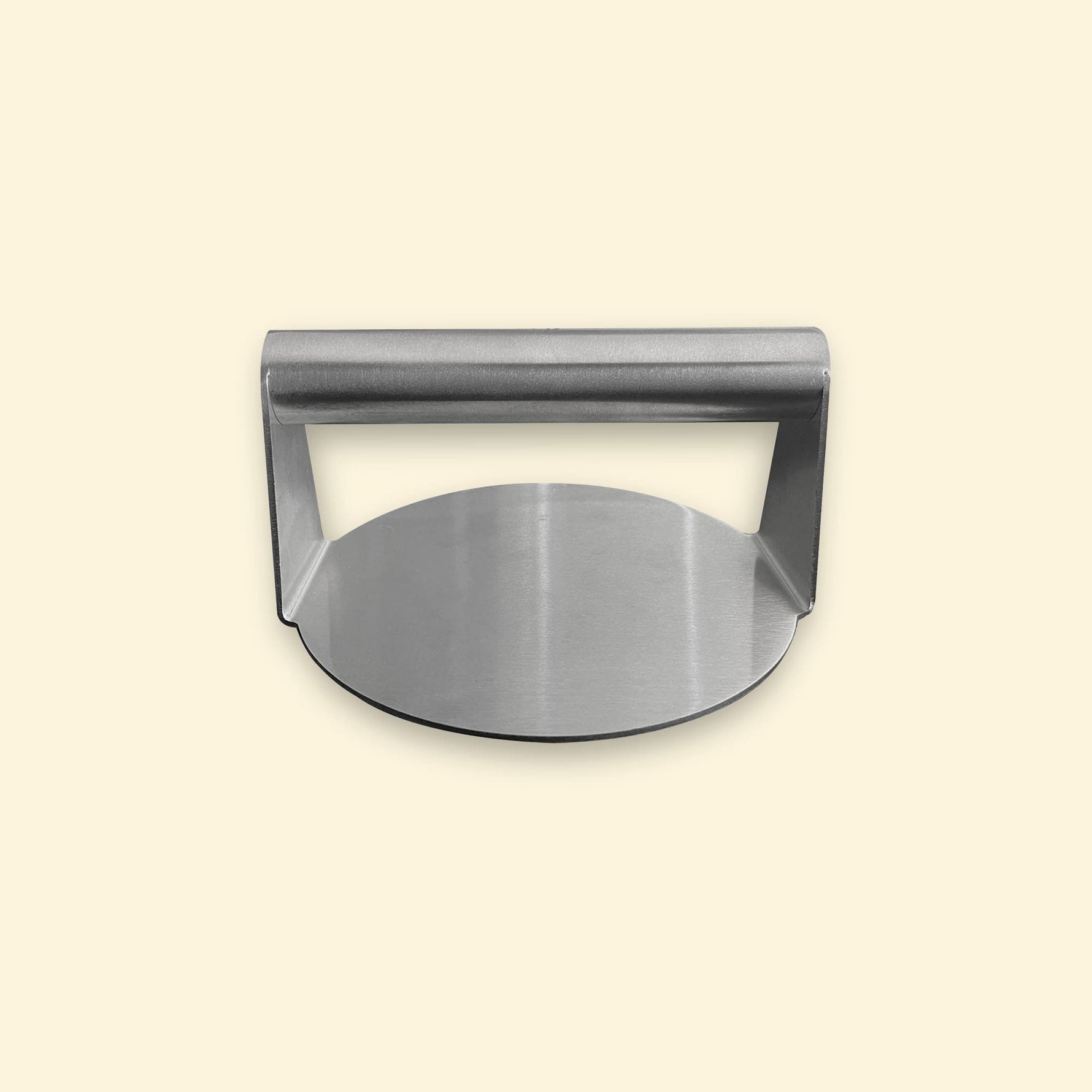 Presse à smash burger en inox vue de face, avec une poignée cylindrique et une base ronde plate.